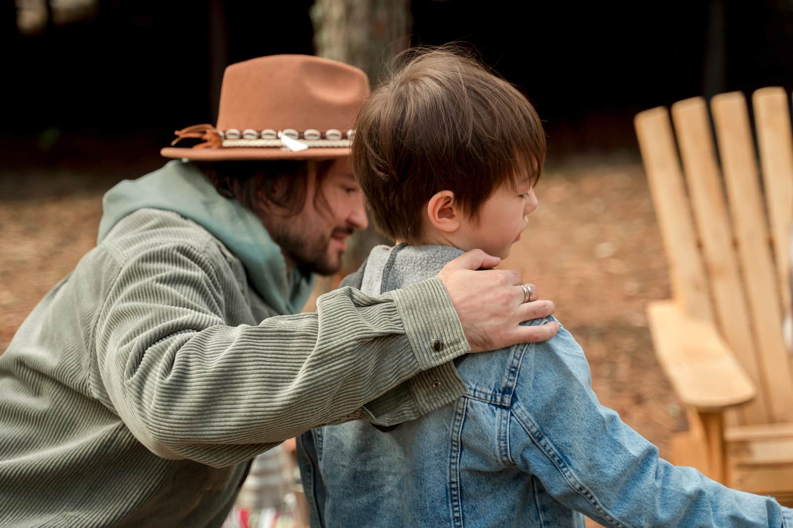 A father and son together at a campsite