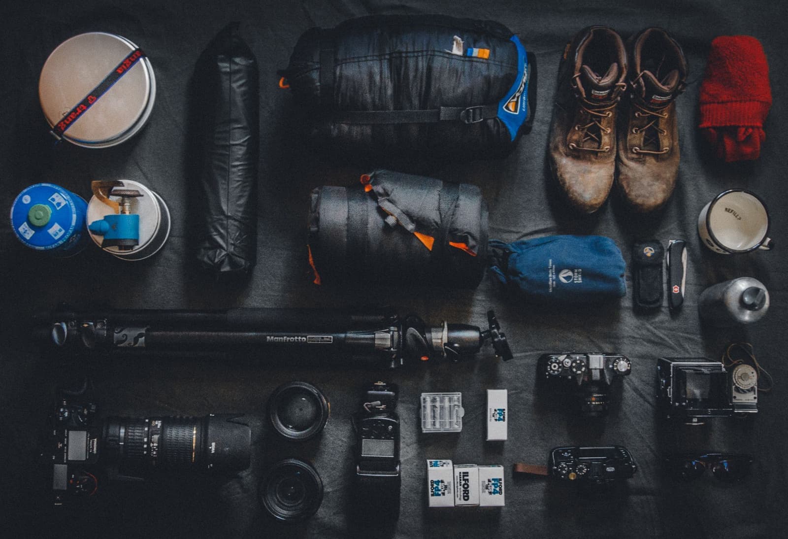 Outdoor and camping gear laid out neatly in a flat lay